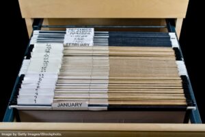 a tickler file comprised of 43 hanging file folders in a filing cabinet drawer