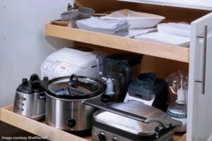 cupboard with pull out drawers by Shelf Genie in a kitchen and pantry