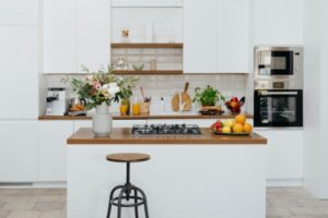 tidy kitchen with white cupboards