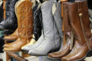 boots hanging from a rack - ways to store boots