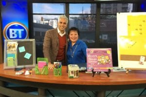 Linda Chu on television set explaining a family command centre