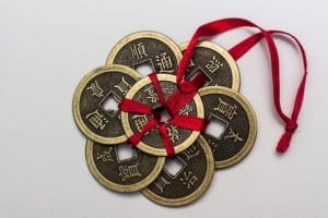 Chinese coins tied with red ribbon