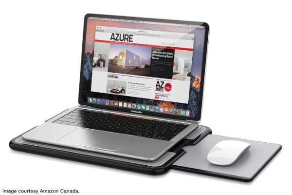 laptop sitting on laptop tray with slide-out mouse pad