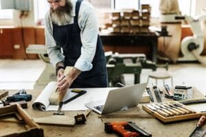 carpenter working in woodshop doing job tasks and productivity