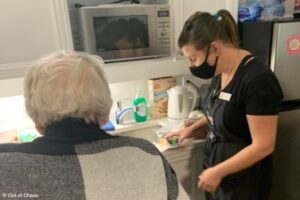 out of chaos team member helping seniors move