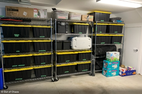 organizing your garage using black bins with yellow lids neatly arranged on heavy-duty stainless steel shelving