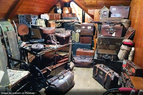 storage and utility rooms filled with clutter including suitcases, furniture and more